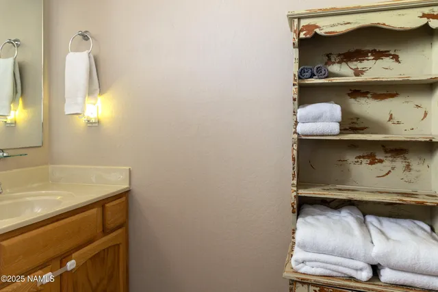 a bathroom with a sink and vanity