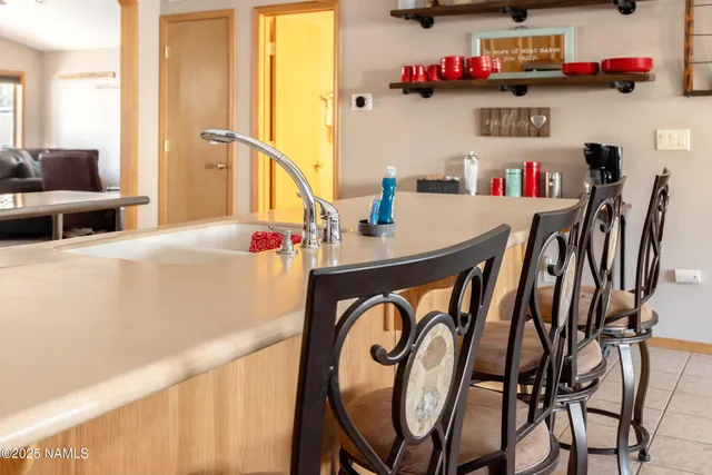 a bathroom with a table and chairs