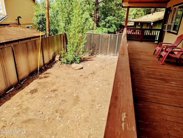 a view of a backyard with sitting area