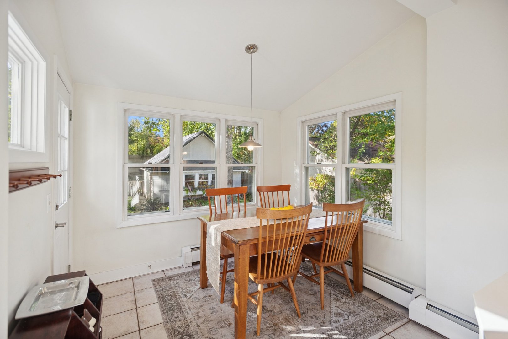 228 Poplar Street Winnetka, IL 60093 - Photo 11 of 34 a dining room with furniture a chandelier and wooden floor
