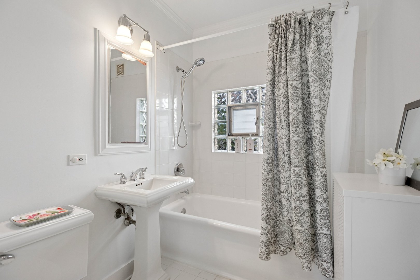 228 Poplar Street Winnetka, IL 60093 - Photo 14 of 34 a bathroom with a sink a toilet and shower
