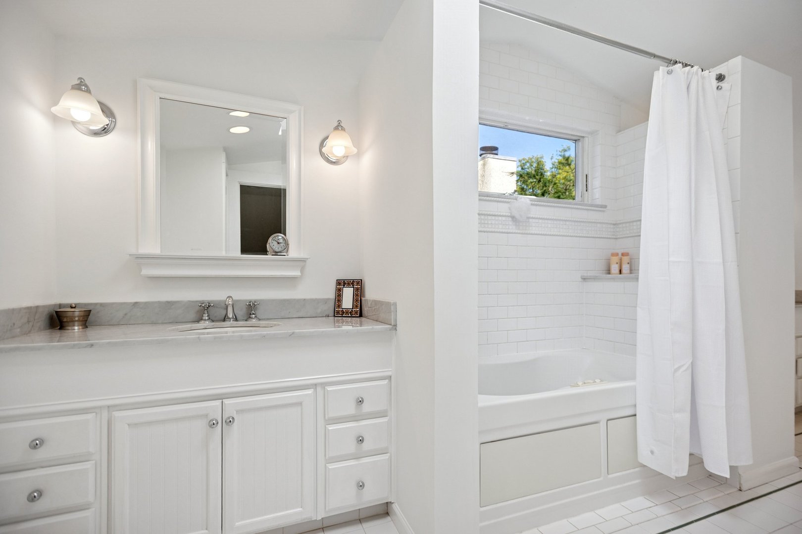 228 Poplar Street Winnetka, IL 60093 - Photo 17 of 34 a bathroom with a granite countertop sink and a mirror