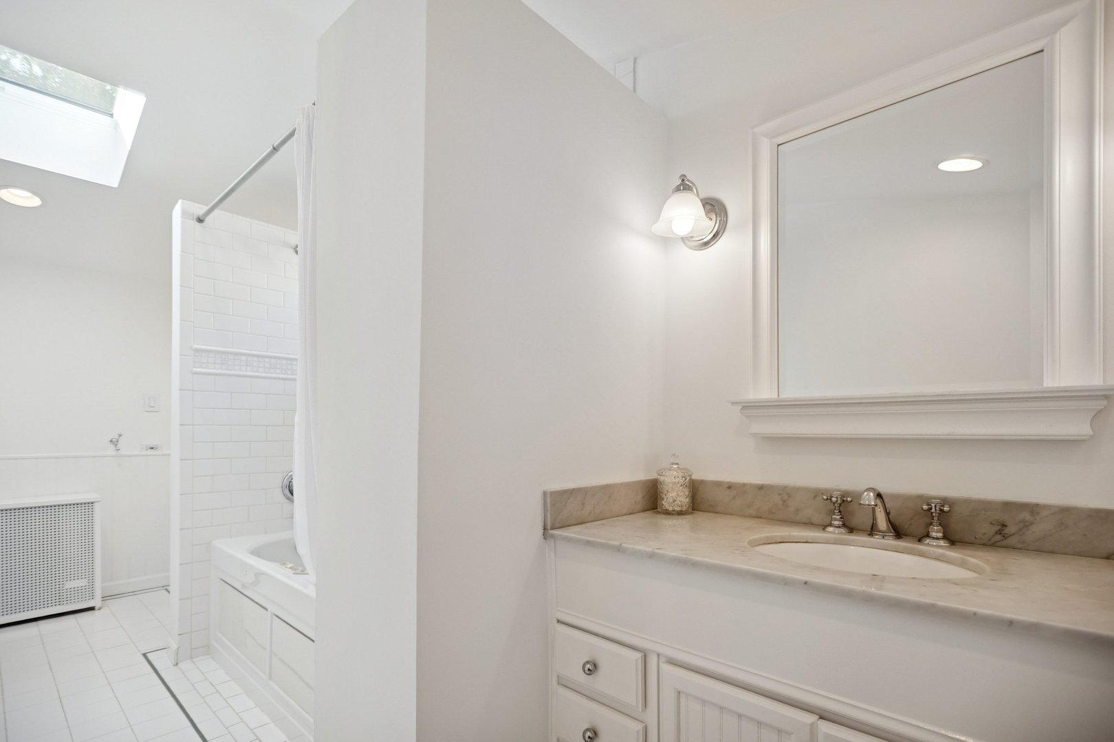 228 Poplar Street Winnetka, IL 60093 - Photo 18 of 34 a bathroom with a granite countertop sink and a mirror