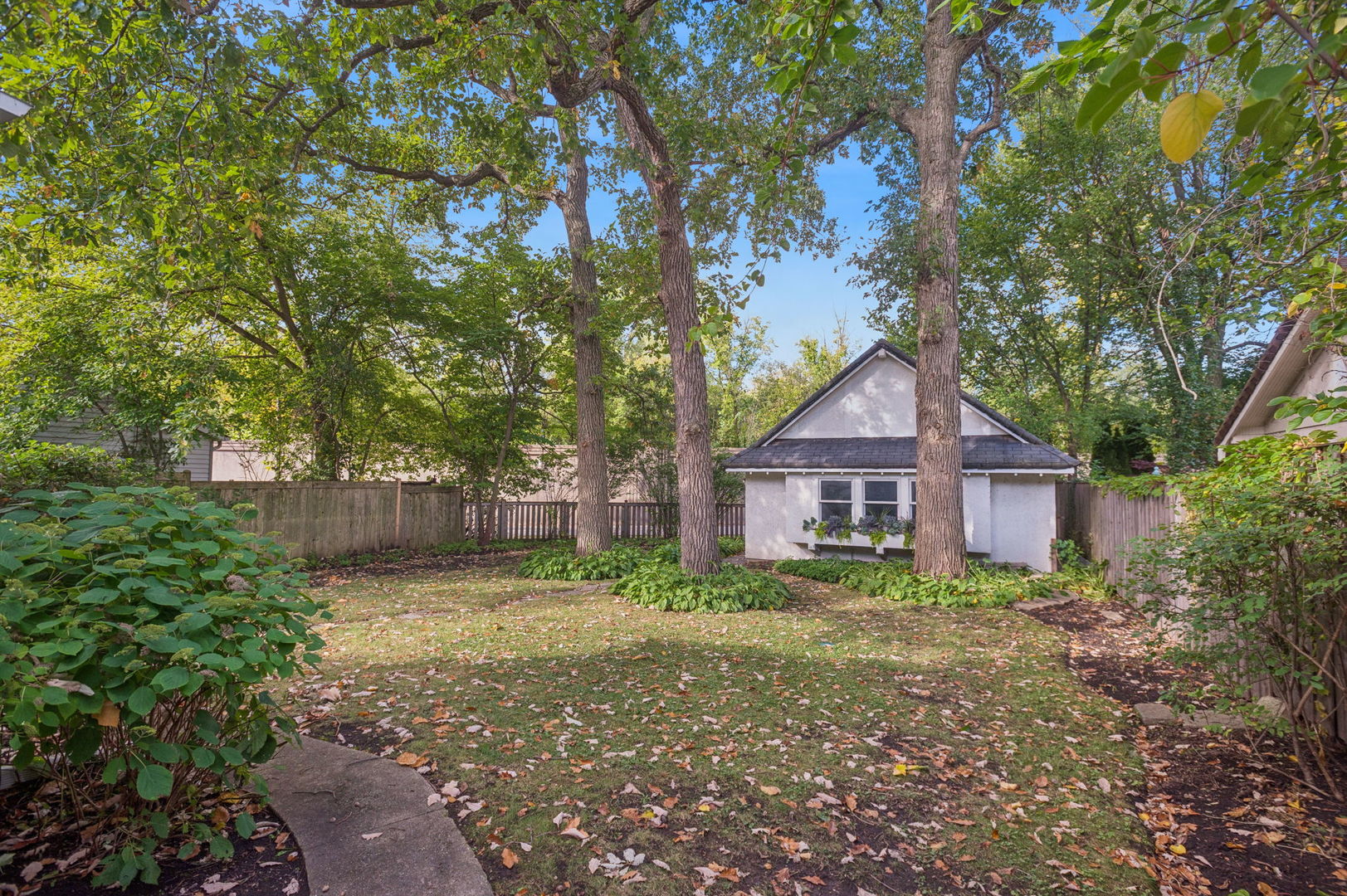 228 Poplar Street Winnetka, IL 60093 - Photo 28 of 34 a house with a tree in front of it