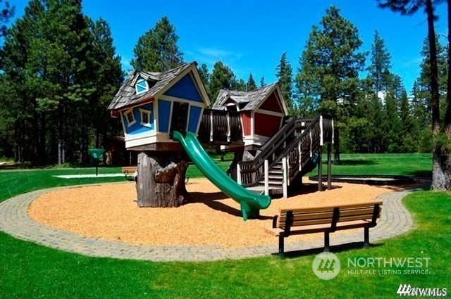 610 Spragger Way Cle Elum, WA 98922 - Photo 13 of 17 a park view with a bench in a garden