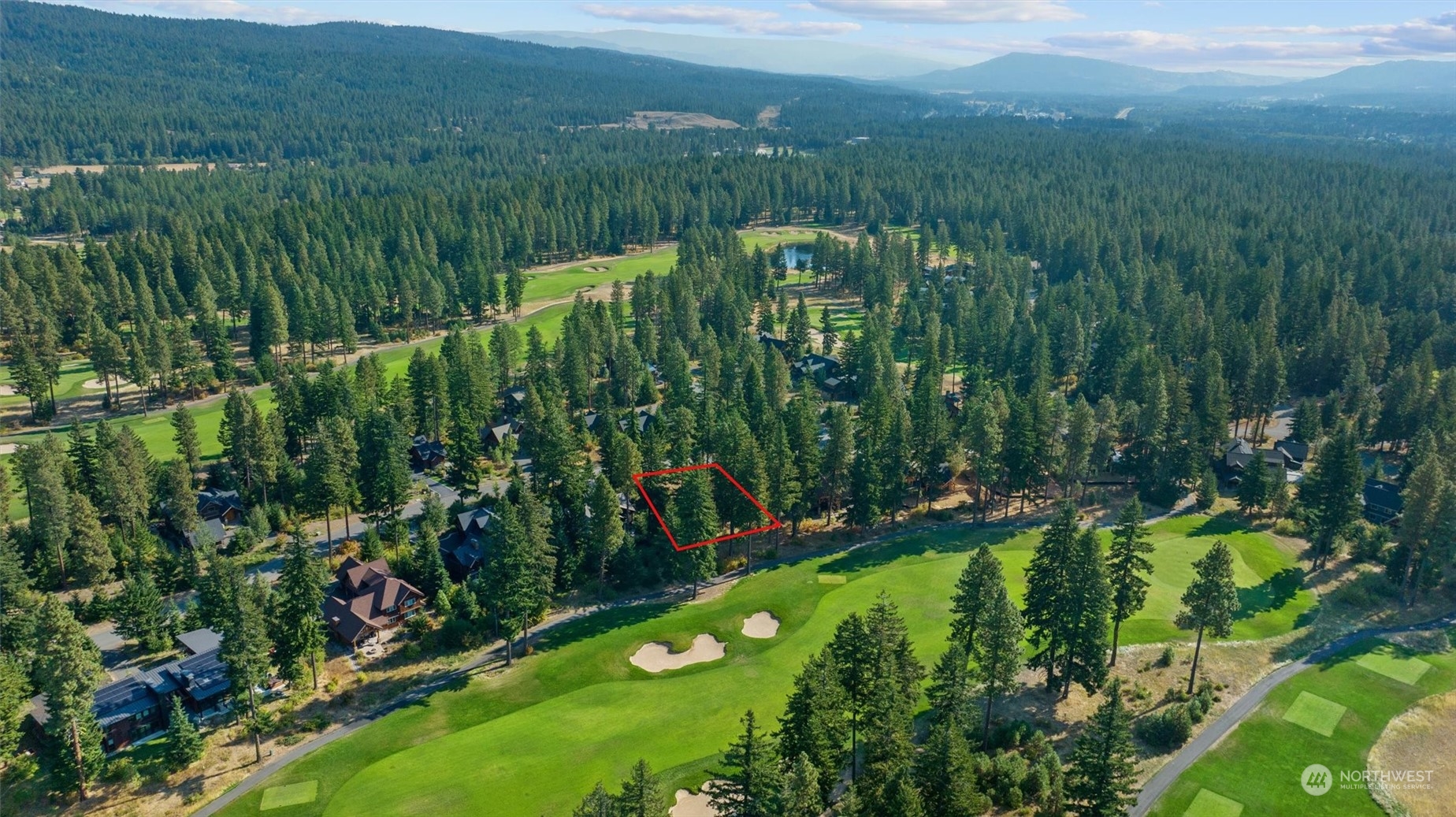 610 Spragger Way Cle Elum, WA 98922 - Photo 6 of 17 a view of a lush green forest with a lake