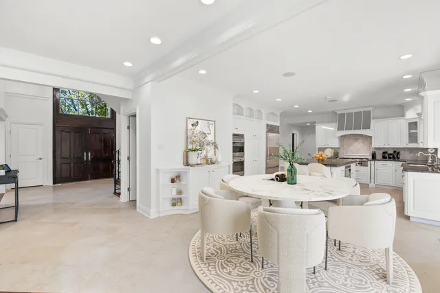 a bathroom with a granite countertop sink a toilet and bathtub