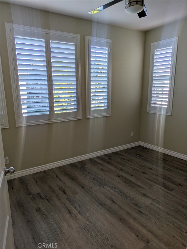 42945 Avenida Amistad Temecula, CA 92592 - Photo 23 of 32 Upstairs bedroom 2 with ceiling fan and plantation shutters