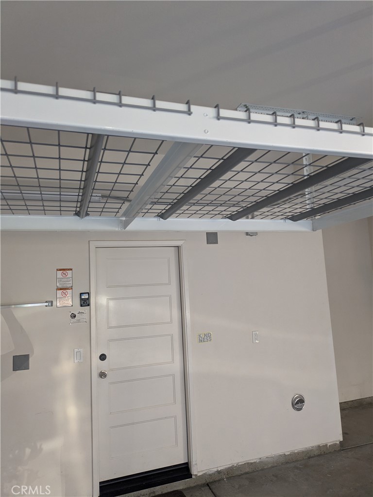 42945 Avenida Amistad Temecula, CA 92592 - Photo 26 of 32 Garage has built in overhead storage racks