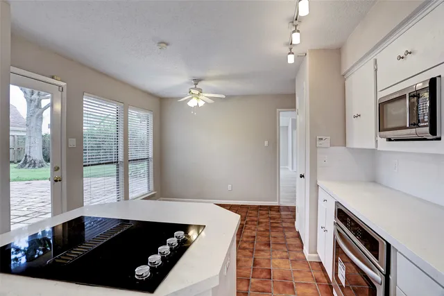 a view of a livingroom with furniture and chandelier