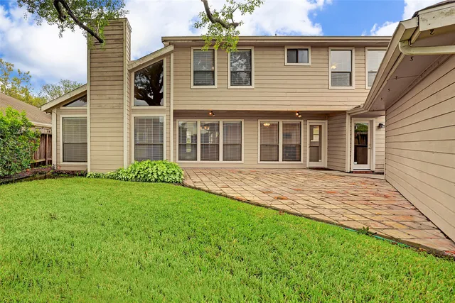 a house with garden in front of it