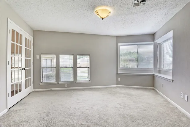 an empty room with windows