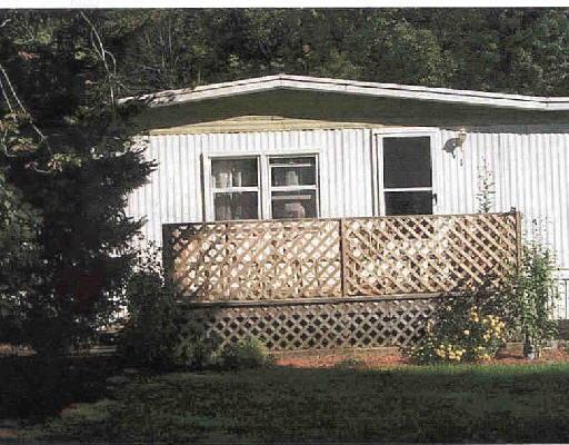 160 Mt Pleasant Road, Unit 1 Newtown, CT 06470 - Photo 1 of 1 a front view of a house with a garden