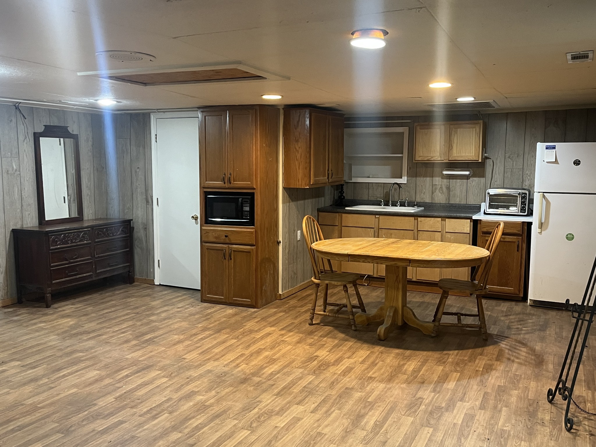 535 Gladeville Road Mount Juliet, TN 37122 - Photo 20 of 24 a kitchen with a table chairs refrigerator and cabinets