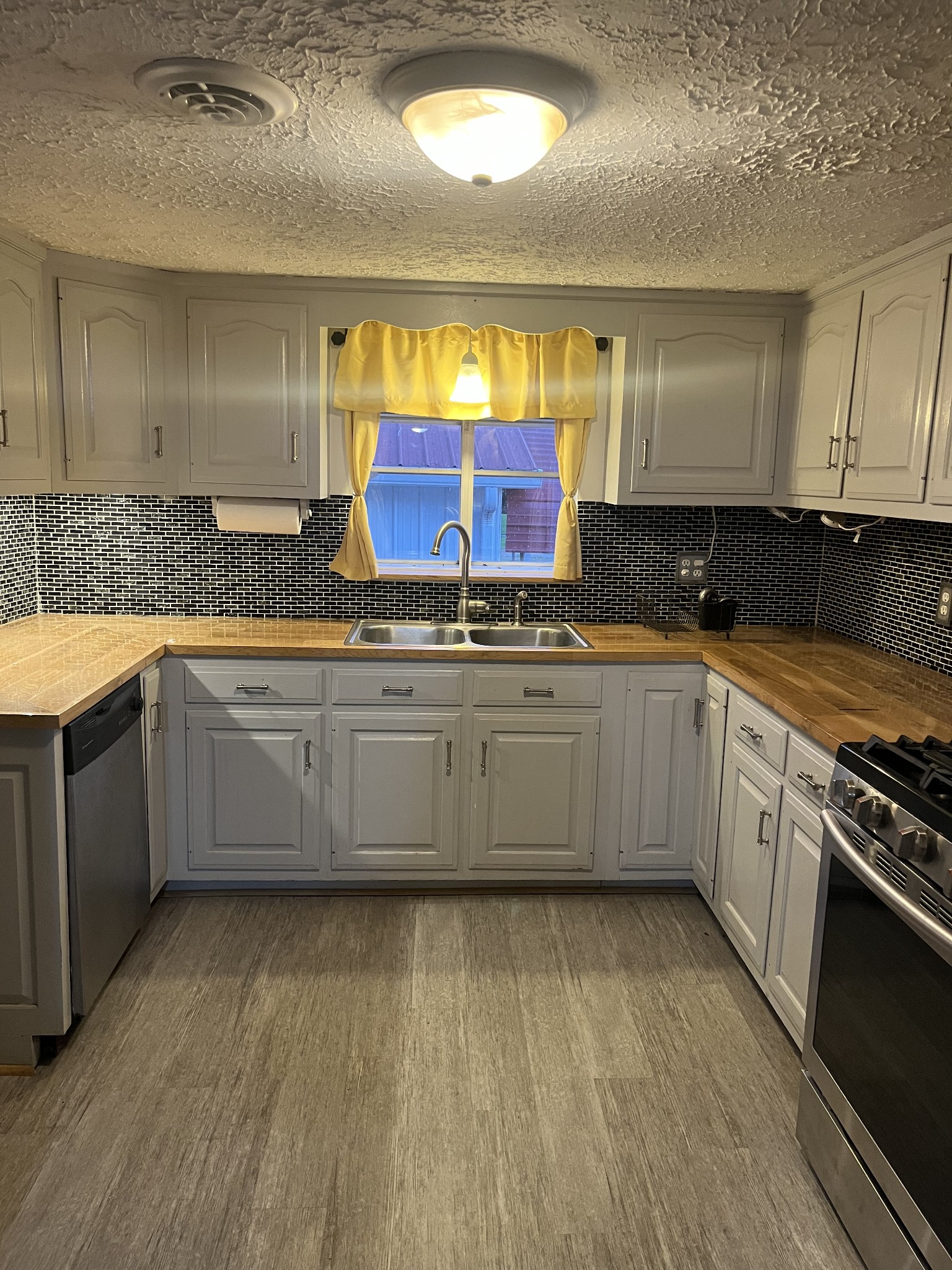 535 Gladeville Road Mount Juliet, TN 37122 - Photo 9 of 24 a kitchen with stainless steel appliances a sink and a stove