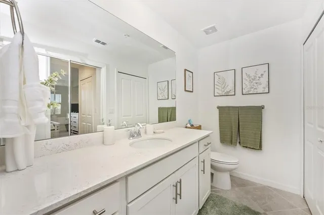 a building outdoor space with patio furniture and potted plants