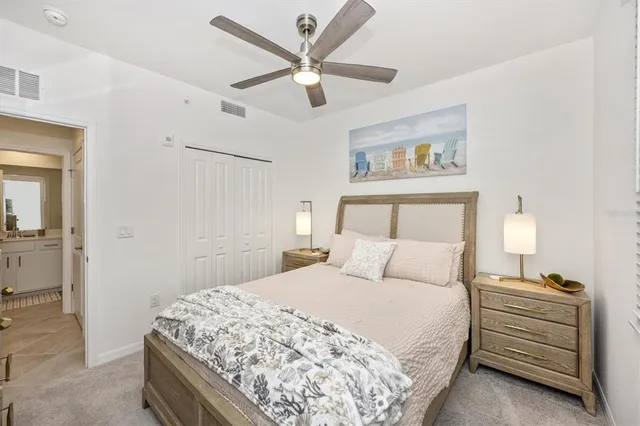 a swimming pool view with a seating space and a garden view