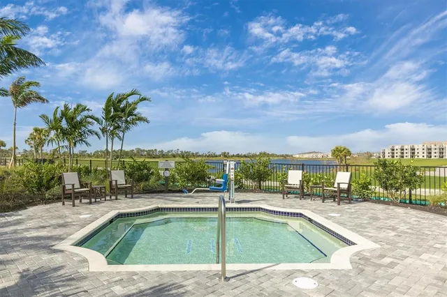 a view of a swimming pool with an ocean and trees
