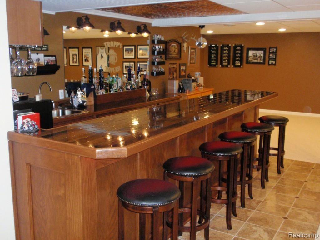 47976 Sandy Ridge Drive Macomb, MI 48044 - Photo 18 of 36 Wet Bar with Tin Ceiling and Bar Refrigerator and Microwave