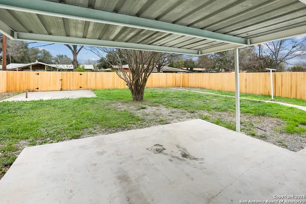 a view of a backyard with a tv