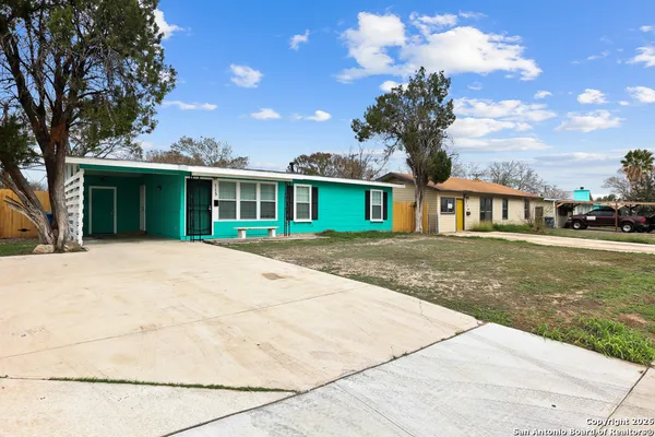 a view of house with yard
