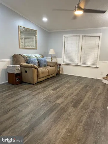 a living room with furniture and window