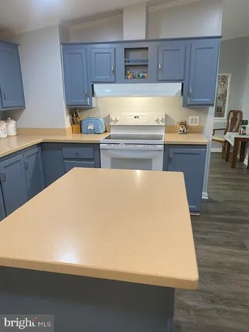 a view of kitchen with wooden floor