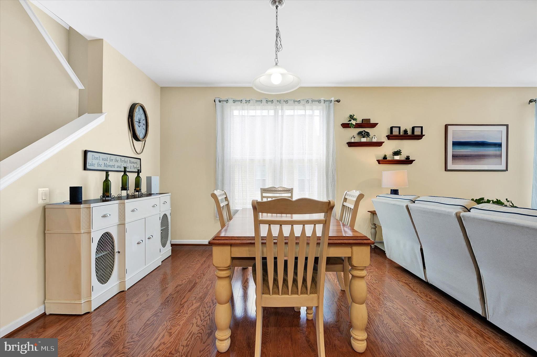 48 Canvasback Circle Bridgeville, DE 19933 - Photo 11 of 44 a view of a dining room with furniture window and wooden floor