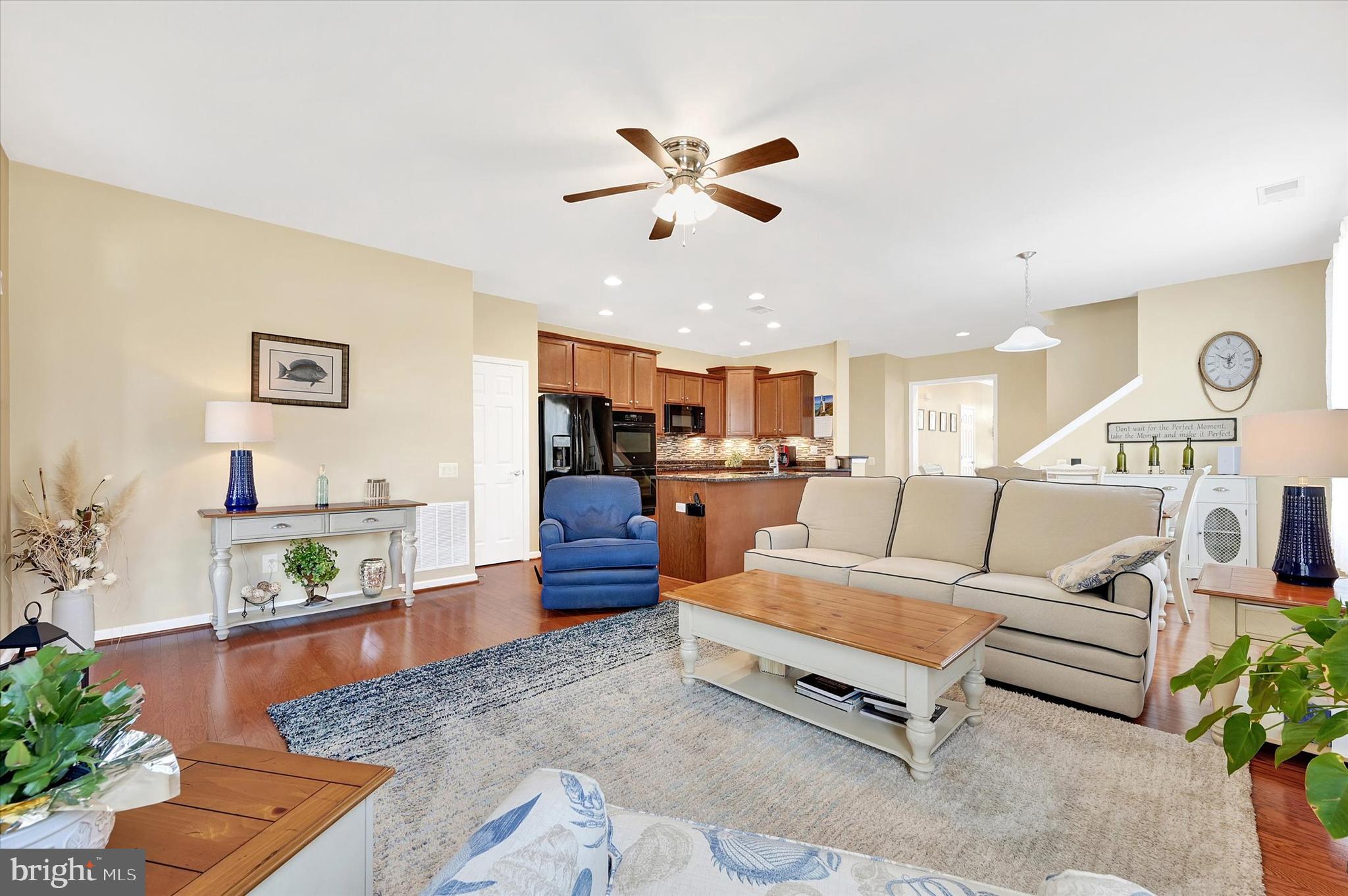 48 Canvasback Circle Bridgeville, DE 19933 - Photo 19 of 44 a living room with furniture kitchen view and a potted plant