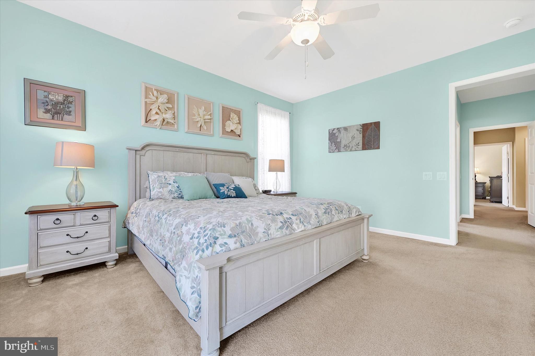 48 Canvasback Circle Bridgeville, DE 19933 - Photo 21 of 44 a bedroom with a bed and a chandelier