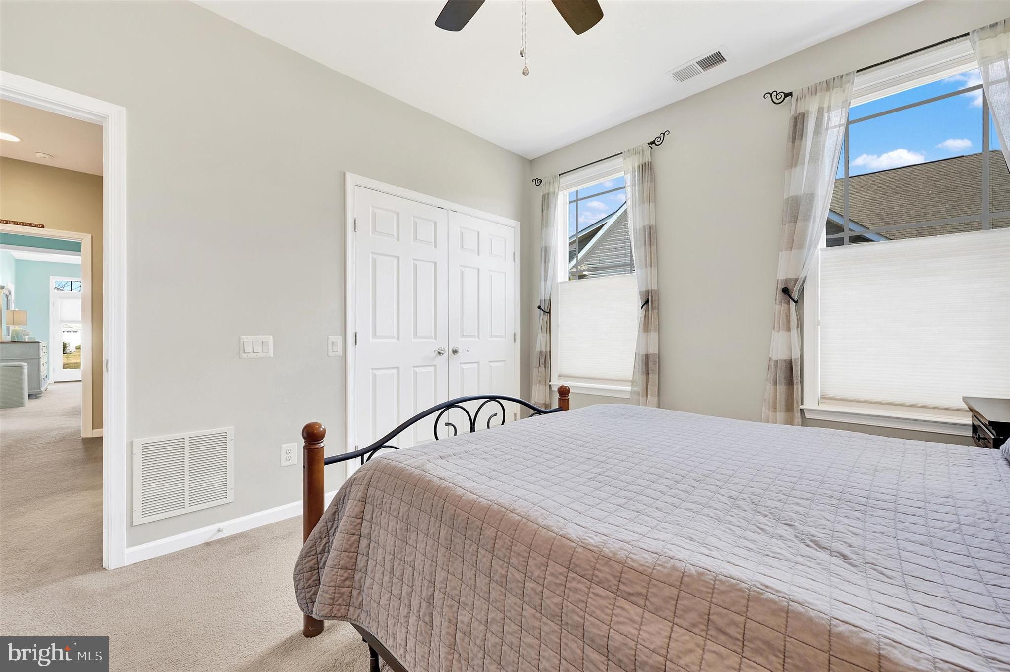 48 Canvasback Circle Bridgeville, DE 19933 - Photo 25 of 44 a bedroom with a bed and a chandelier