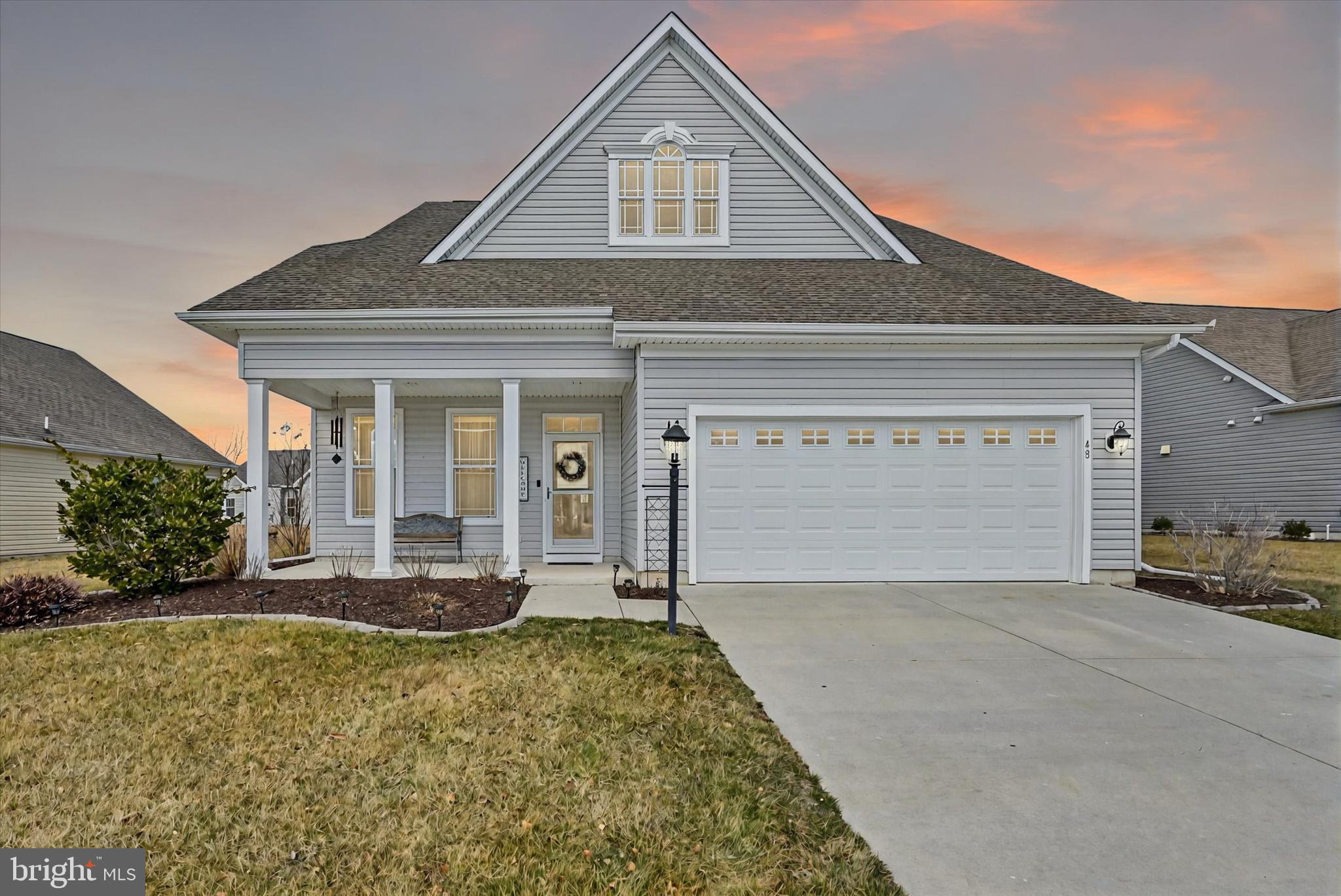 48 Canvasback Circle Bridgeville, DE 19933 - Photo 3 of 44 a front view of a house with a yard and garage