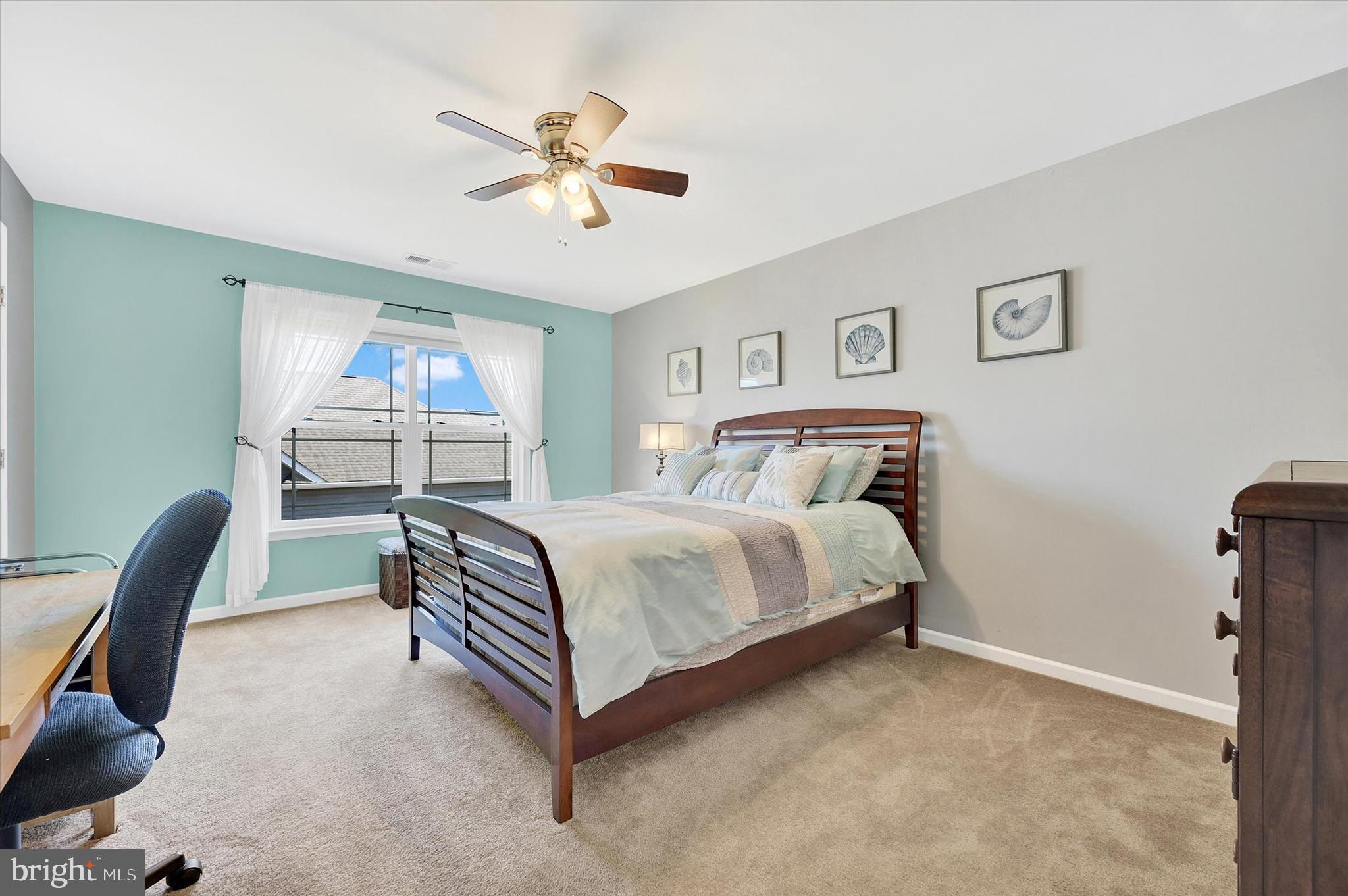 48 Canvasback Circle Bridgeville, DE 19933 - Photo 31 of 44 a bedroom with a bed and a chair