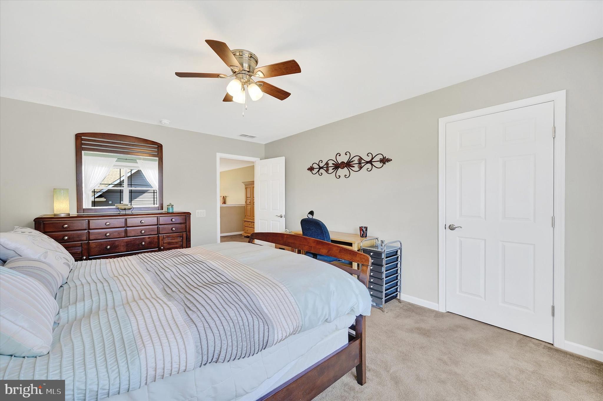 48 Canvasback Circle Bridgeville, DE 19933 - Photo 32 of 44 a bedroom with a bed and a dresser