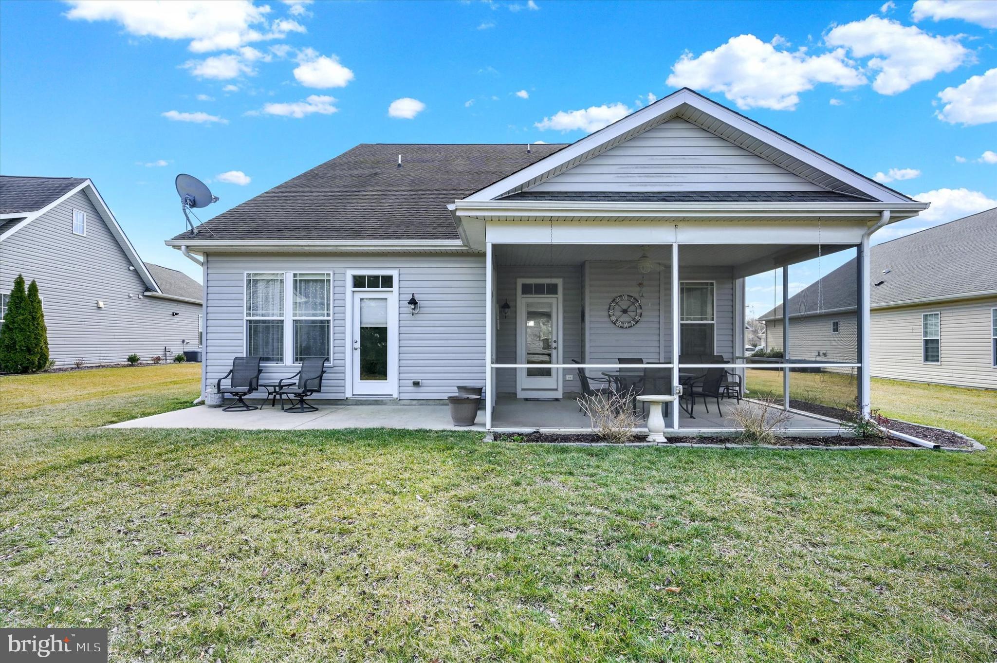 48 Canvasback Circle Bridgeville, DE 19933 - Photo 36 of 44 a view of a house with a patio and a yard