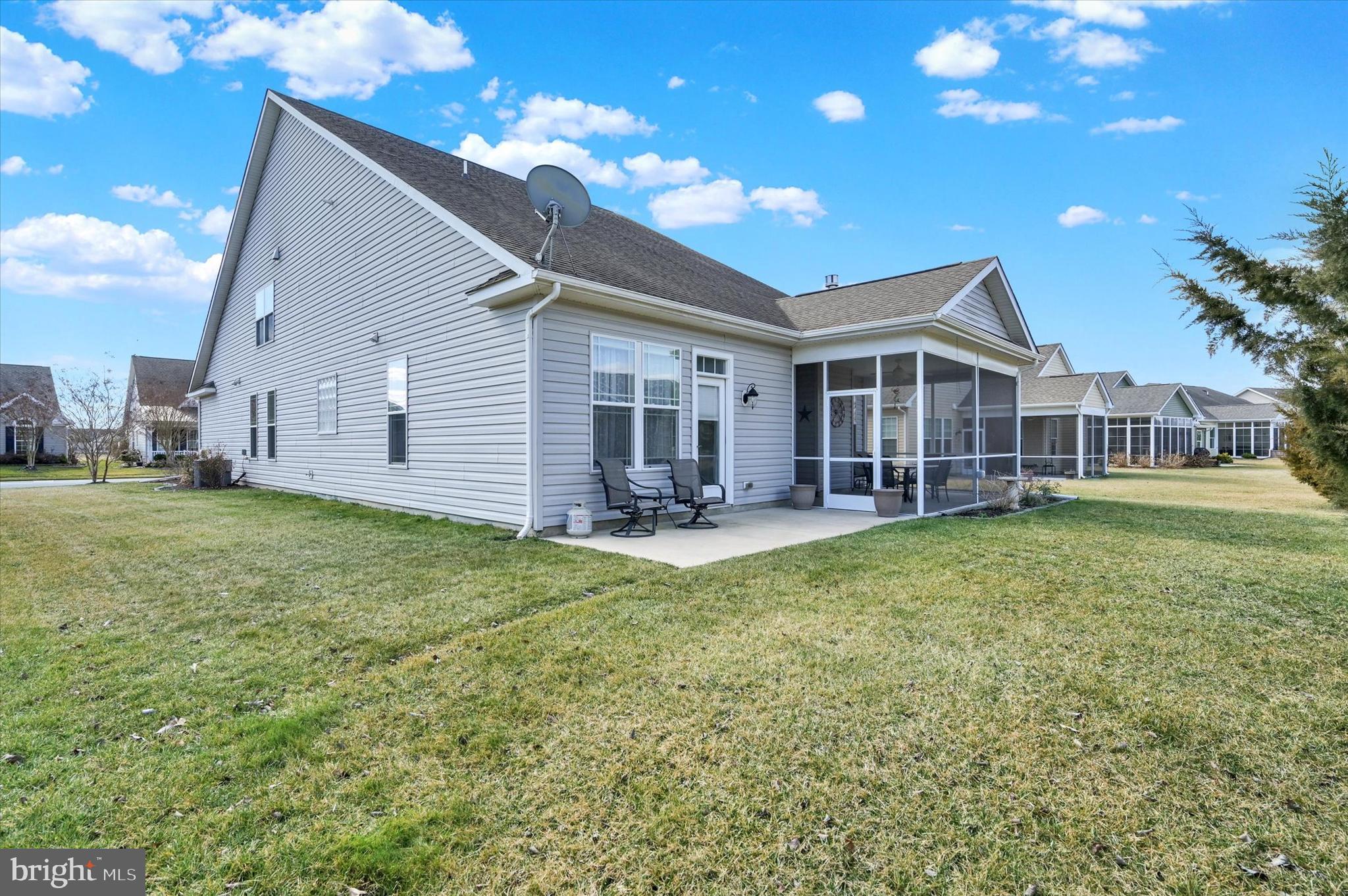 48 Canvasback Circle Bridgeville, DE 19933 - Photo 38 of 44 a view of a house with a backyard porch and sitting area