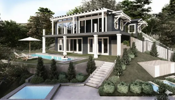 a view of a white house with large windows and a yard