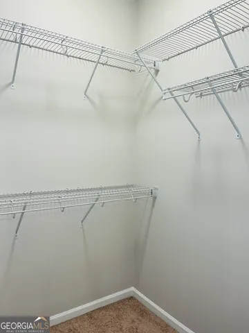 a view of a room with racks on the wall