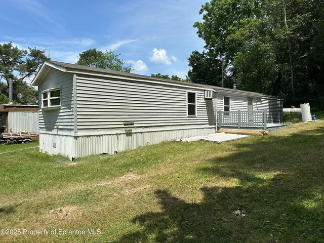a view of kitchen with cabinets