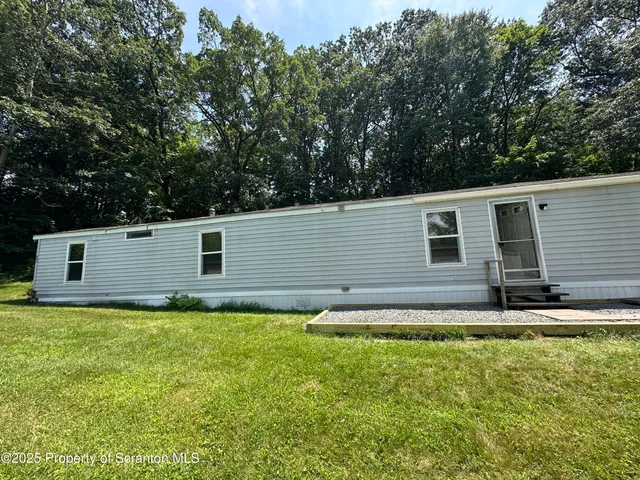 a view of back yard of the house