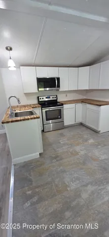 a view of a swimming pool with a yard