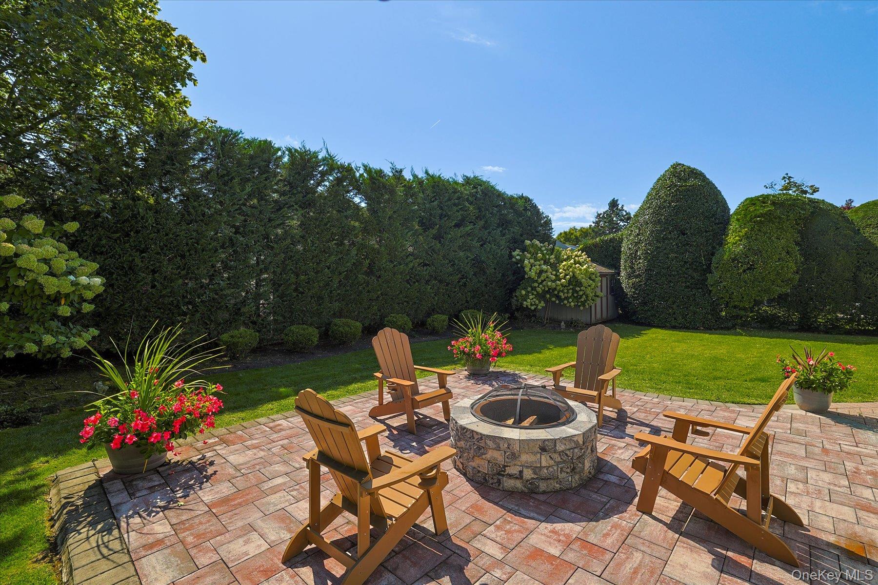 122 Pine Street Rockville Centre, NY 11570 - Photo 5 of 27 a view of a backyard with sitting area and garden