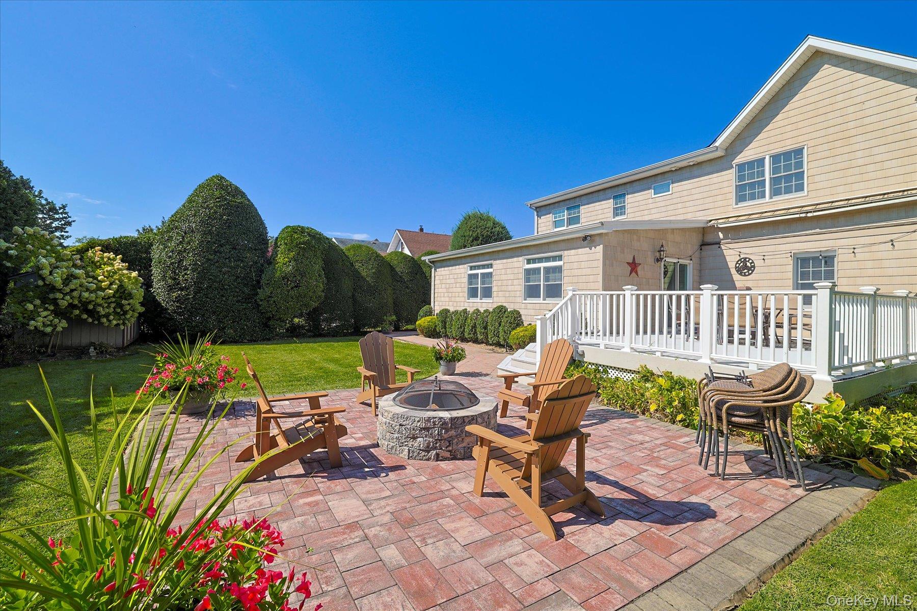 122 Pine Street Rockville Centre, NY 11570 - Photo 6 of 27 a view of a house with backyard sitting area and garden