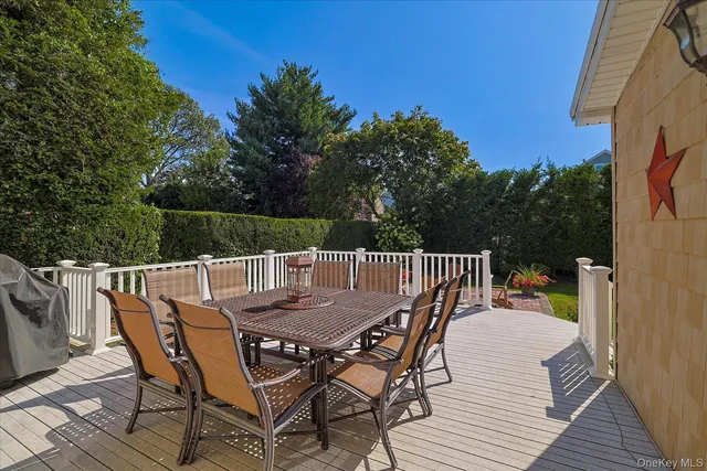 a view of a dinning table and chairs on the roof deck