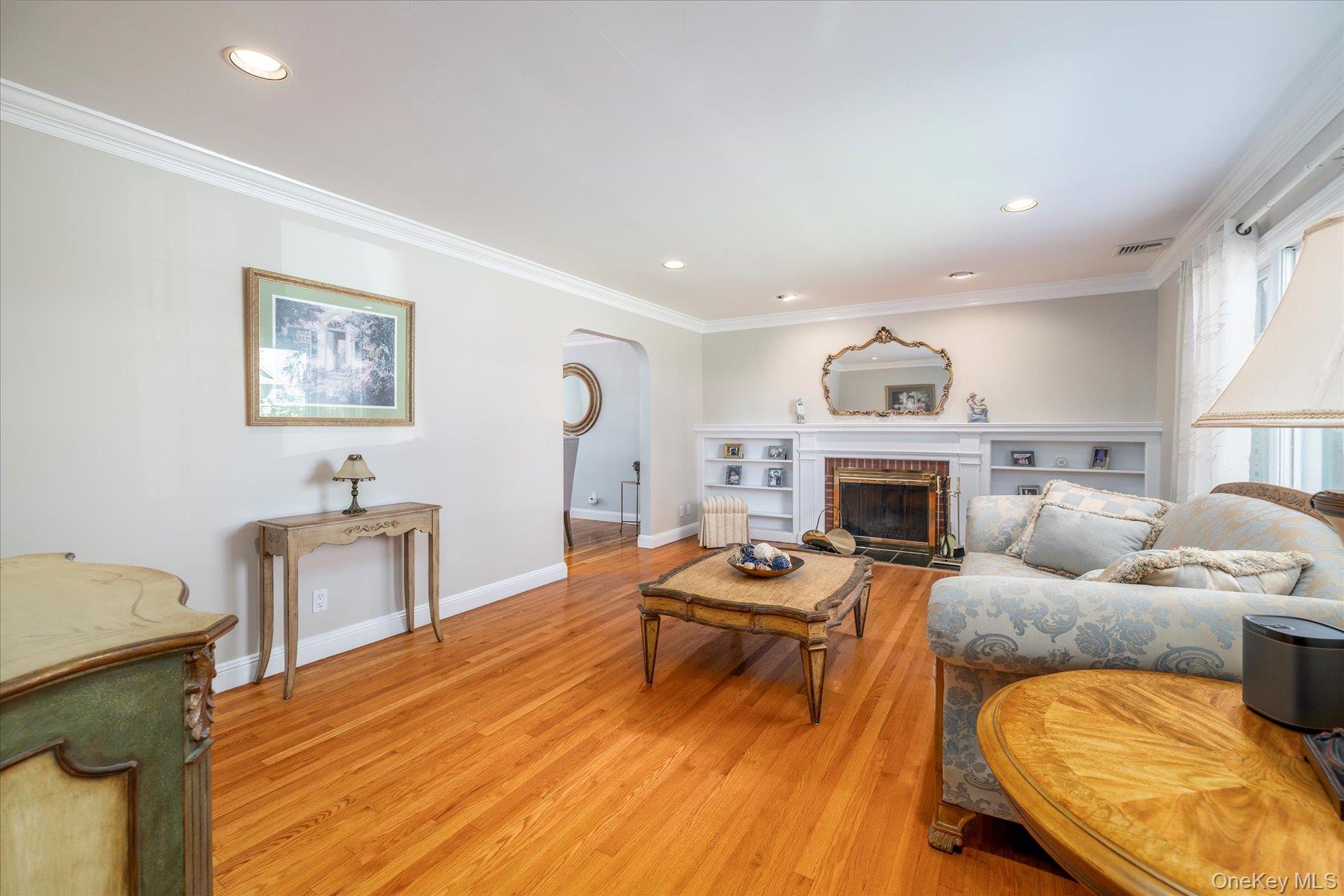 122 Pine Street Rockville Centre, NY 11570 - Photo 9 of 27 a living room with furniture and a fireplace