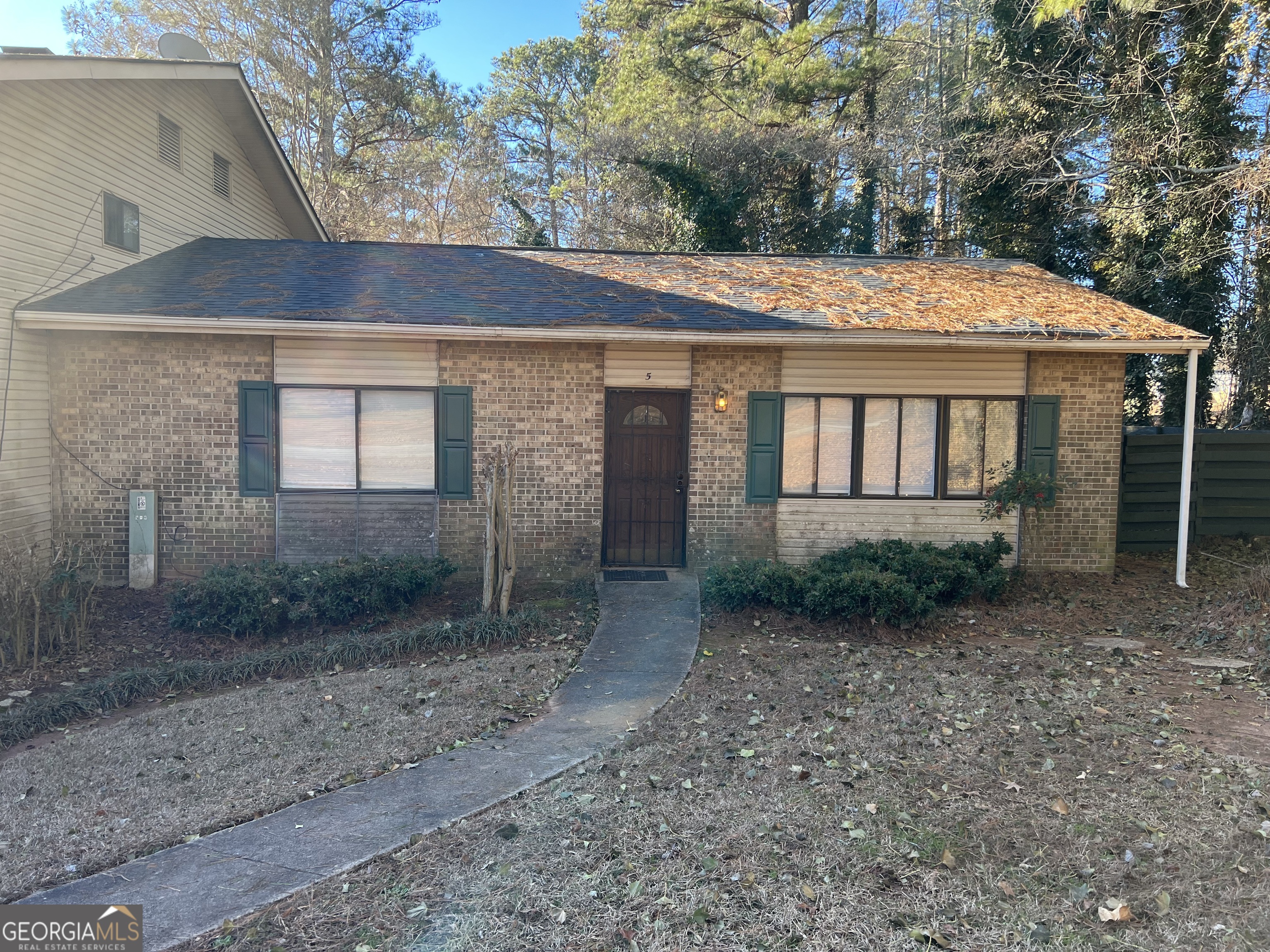 7560 Taylor Road Riverdale, GA 30274 - Photo 1 of 1 a view of a large house with large windows and a large tree