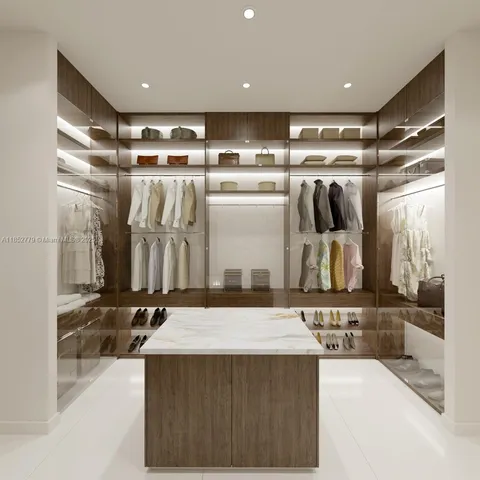 a view of a kitchen with a sink and a refrigerator