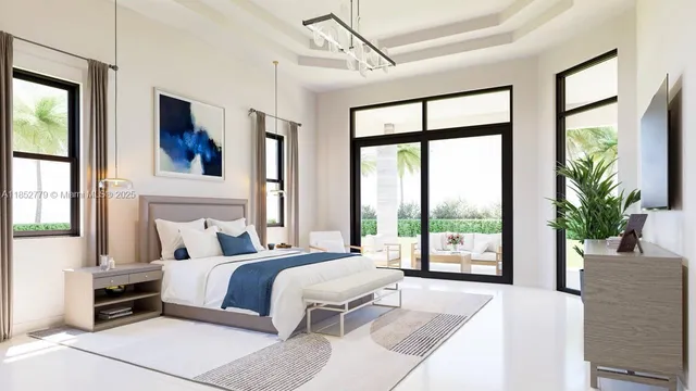 a bedroom with a large bed and a large window