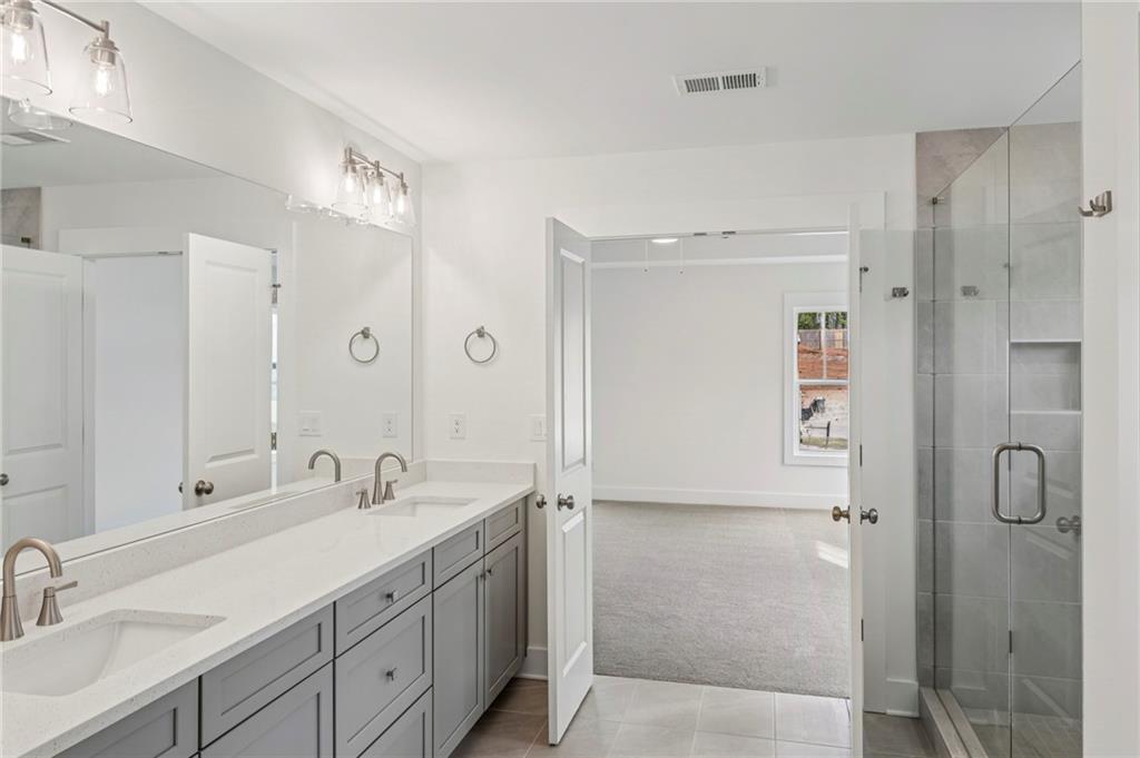 2637 Mills Bend Decatur, GA 30034 - Photo 11 of 14 a bathroom with a double vanity sink mirror and double