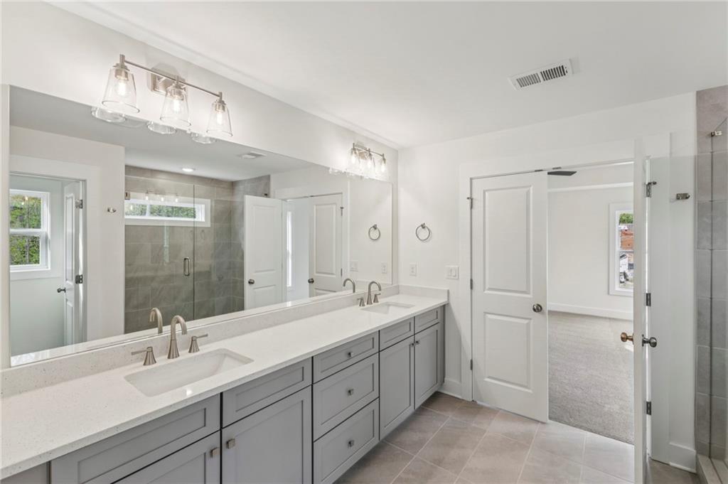 2637 Mills Bend Decatur, GA 30034 - Photo 12 of 14 a spacious bathroom with a double vanity sink mirror and double